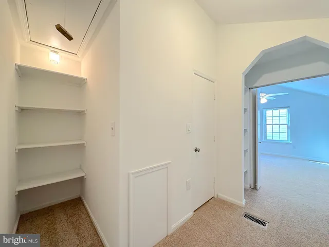 a view of a room with rack on the wall