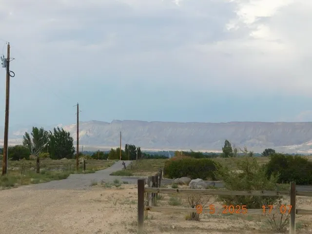 a view of a town with mountains in the background
