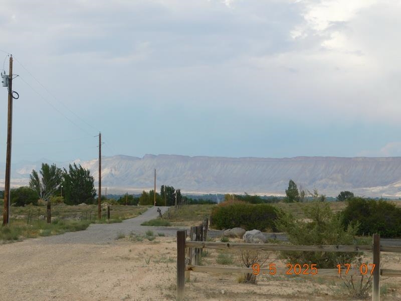 1/2 B 1/2 Road Grand Junction, CO 81503 - Photo 3 of 4 a view of a town with mountains in the background