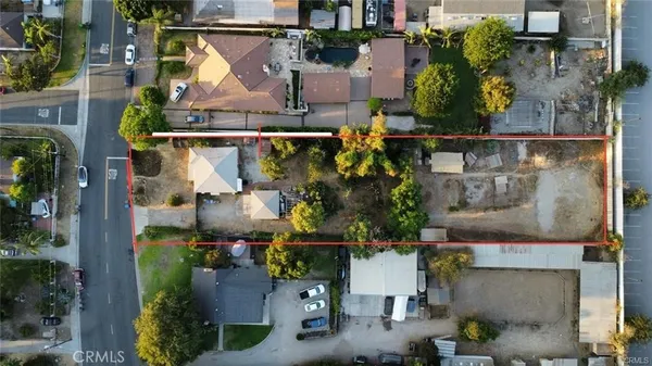 an aerial view of houses with outdoor space