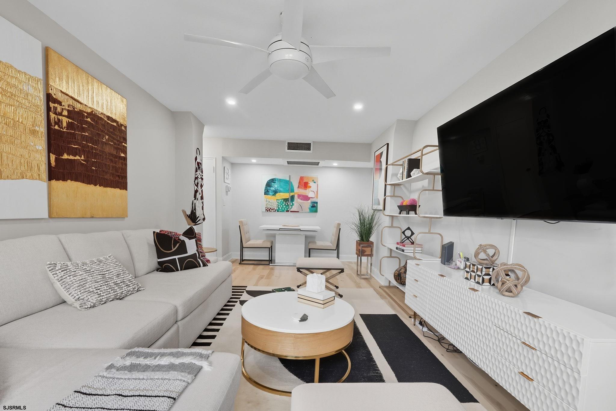 101 South Raleigh Avenue, Unit 809 Atlantic City, NJ 08401 - Photo 14 of 40 a living room with furniture and a flat screen tv