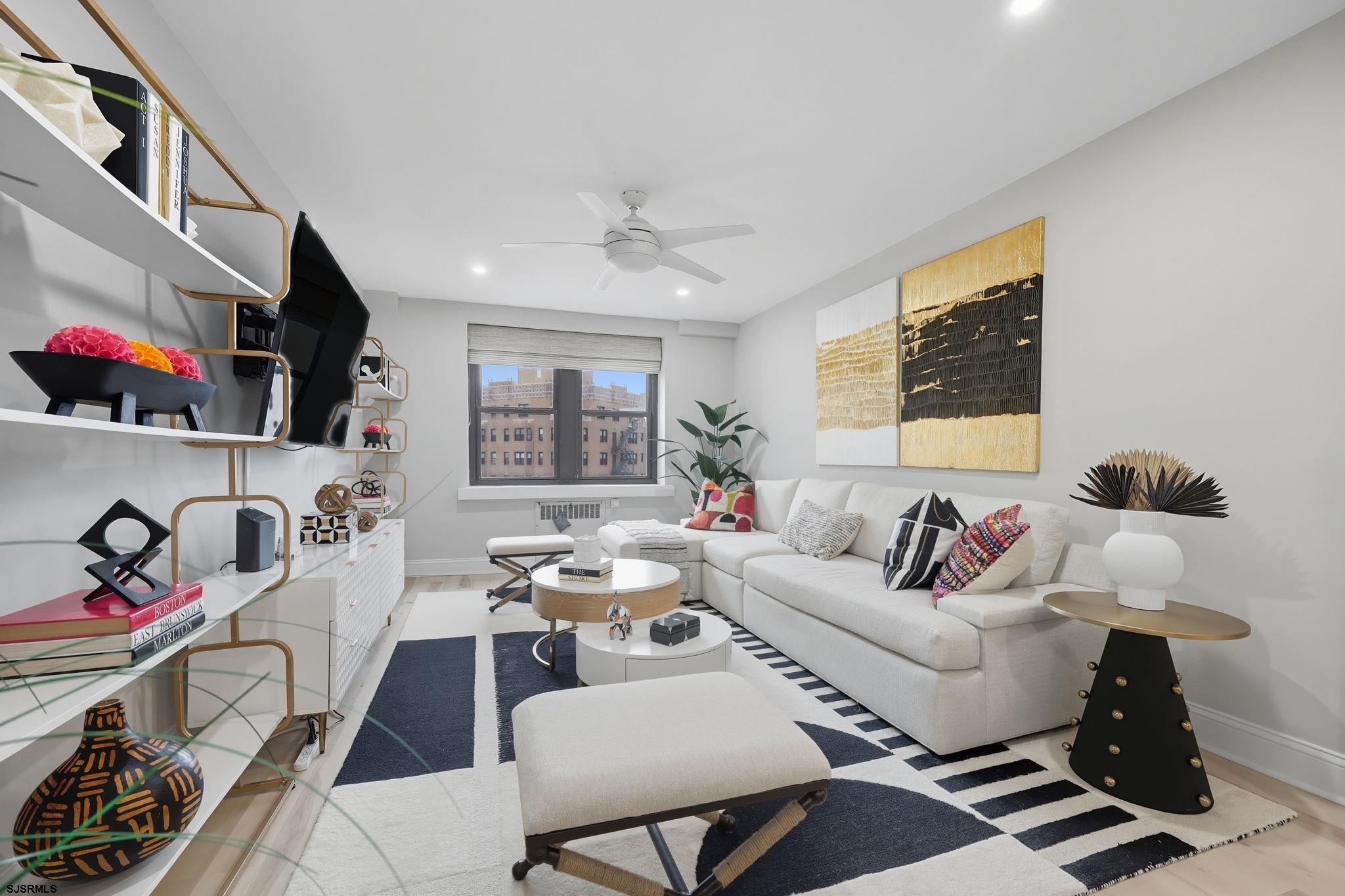 101 South Raleigh Avenue, Unit 809 Atlantic City, NJ 08401 - Photo 16 of 40 a living room with furniture and a flat screen tv