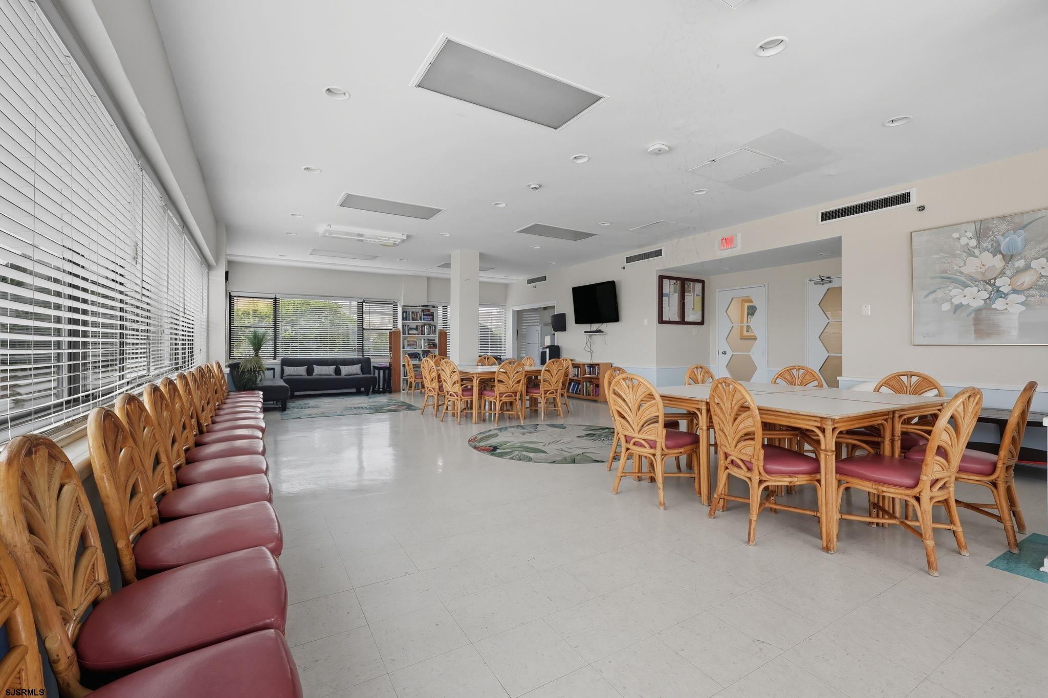 101 South Raleigh Avenue, Unit 809 Atlantic City, NJ 08401 - Photo 30 of 40 a living room with furniture a dining table and chairs