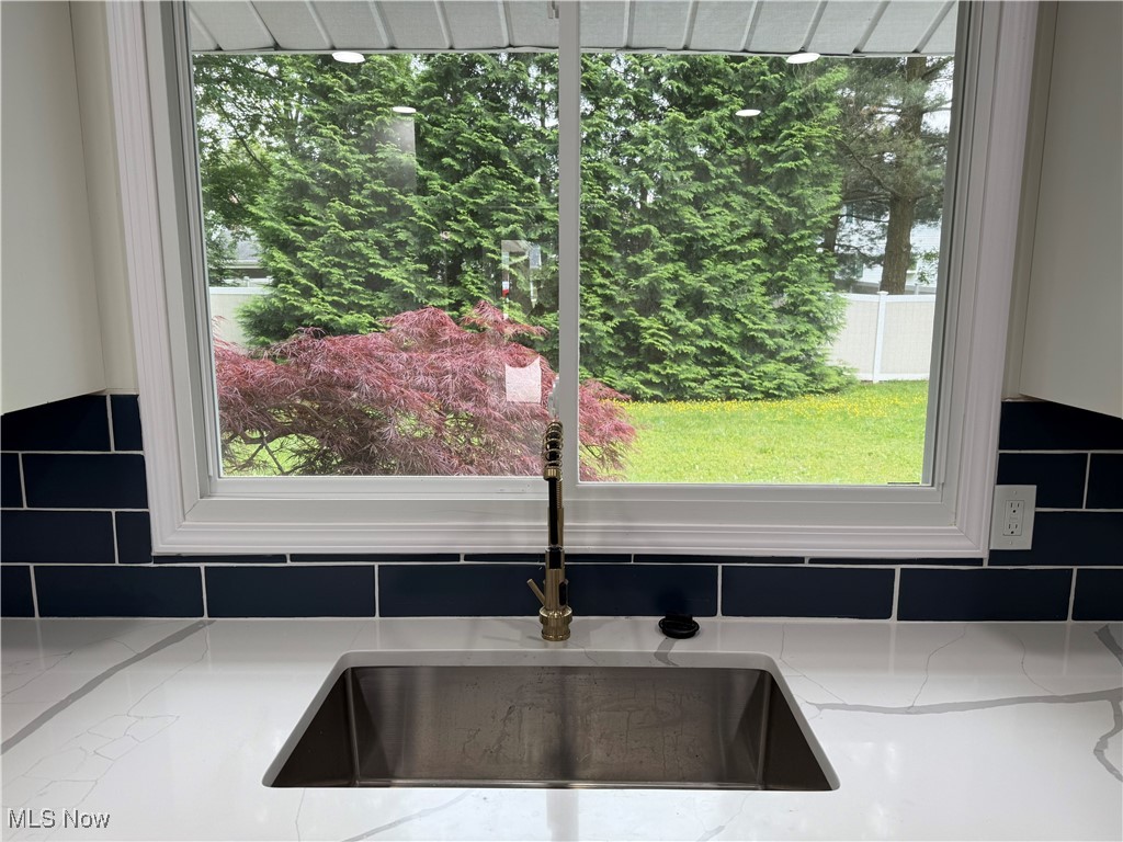 16667 Drake Road Strongsville, OH 44136 - Photo 12 of 30 Kitchen view of light stone countertops and tasteful backsplash