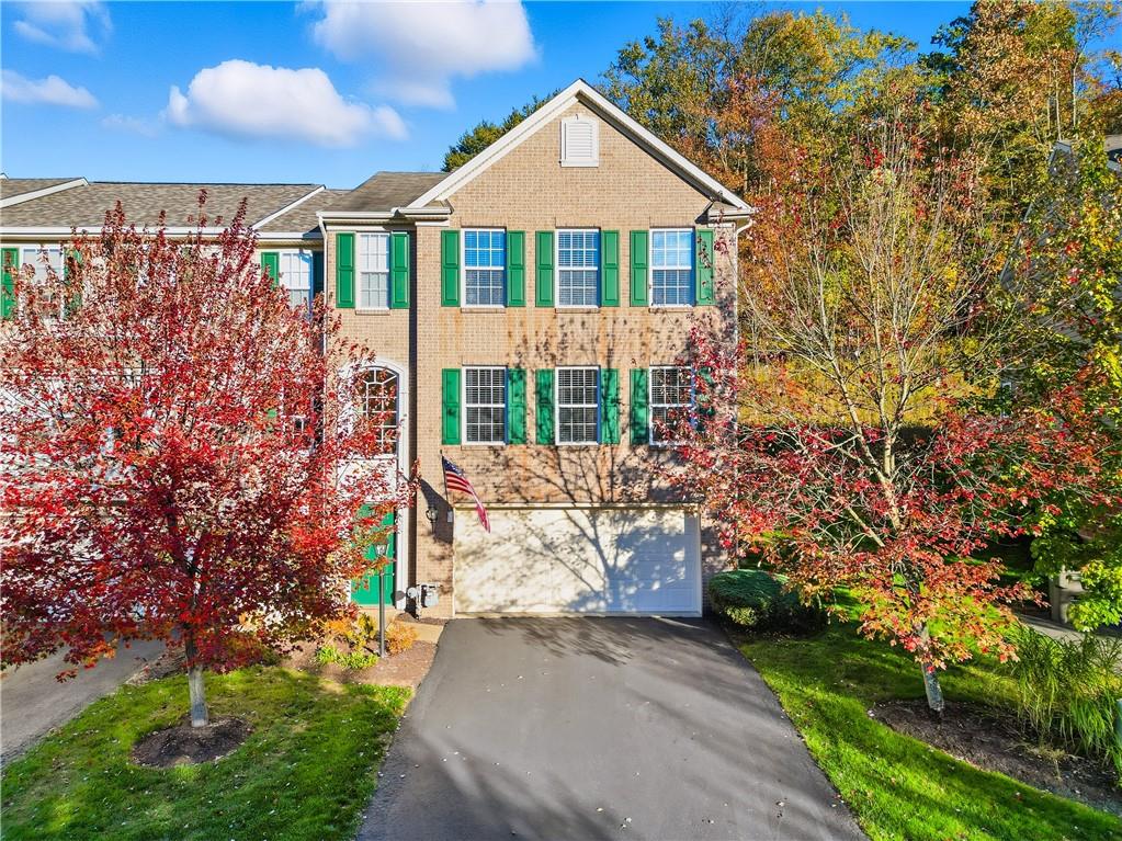 104 Broadstone Drive Mars, PA 16046 - Photo 1 of 30 a front view of a house with a yard and garage