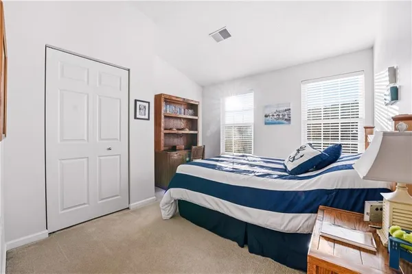 a bedroom with furniture and window