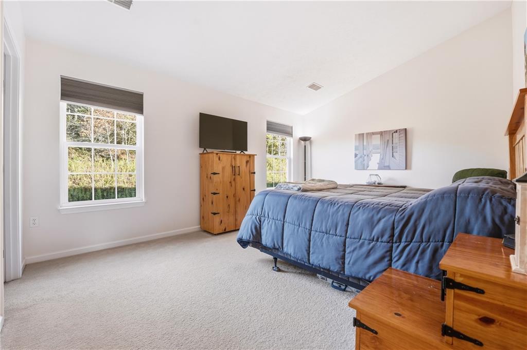 104 Broadstone Drive Mars, PA 16046 - Photo 18 of 30 a bedroom with a bed and a dresser