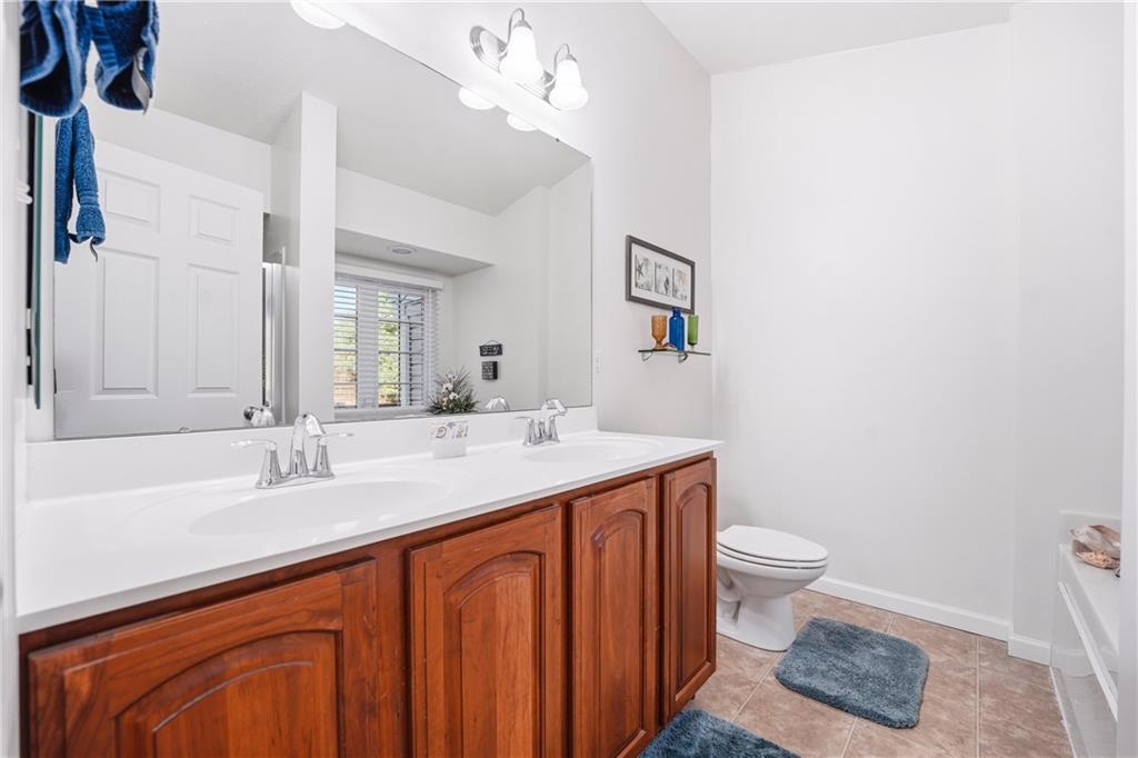 104 Broadstone Drive Mars, PA 16046 - Photo 19 of 30 a bathroom with a sink a toilet and a mirror