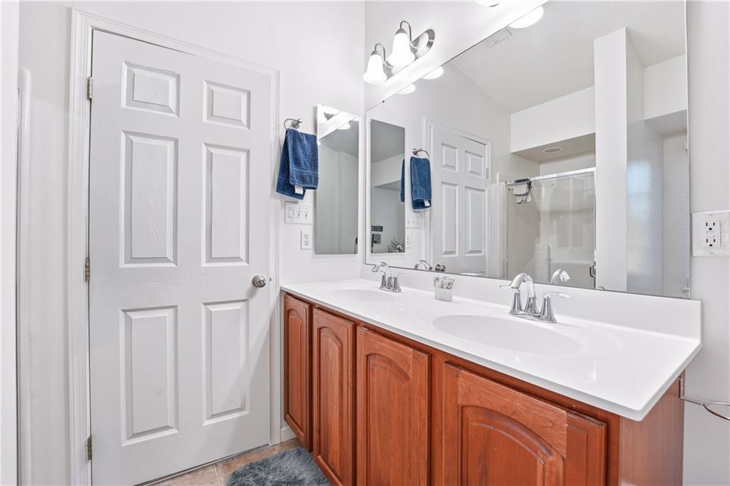 104 Broadstone Drive Mars, PA 16046 - Photo 21 of 30 a bathroom with double sink and a mirror