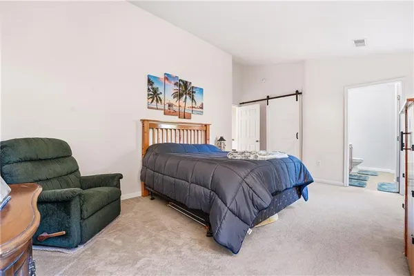 a bed room with a bed and a window