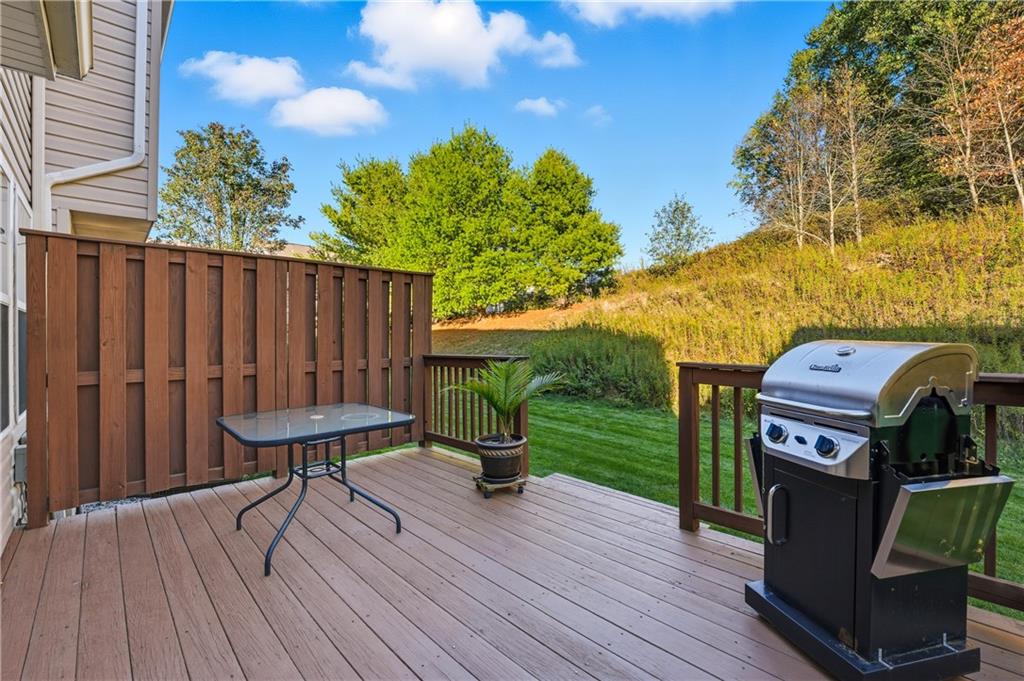 104 Broadstone Drive Mars, PA 16046 - Photo 27 of 30 a view of a deck with a table and chairs with wooden floor and fence