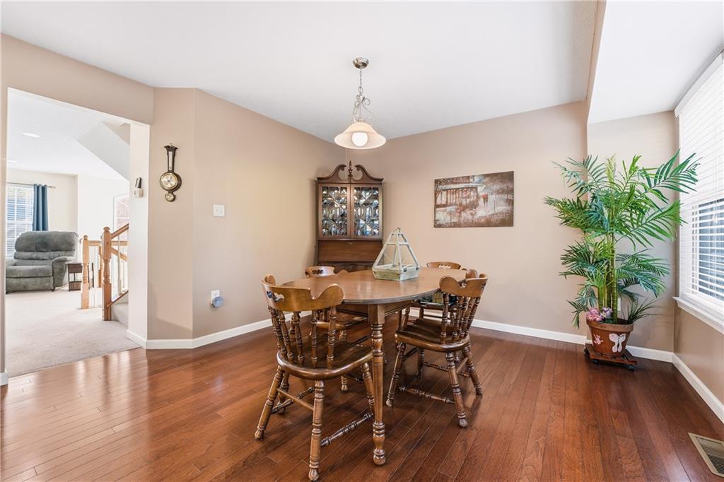 104 Broadstone Drive Mars, PA 16046 - Photo 9 of 30 a view of a dining room with furniture wooden floor and chandelier