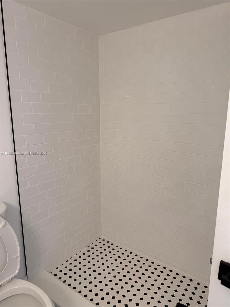 4163 Southwest 66th Terrace, Unit 108 Davie, FL 33314 - Photo 13 of 15 a bathroom with a sink and a toilet