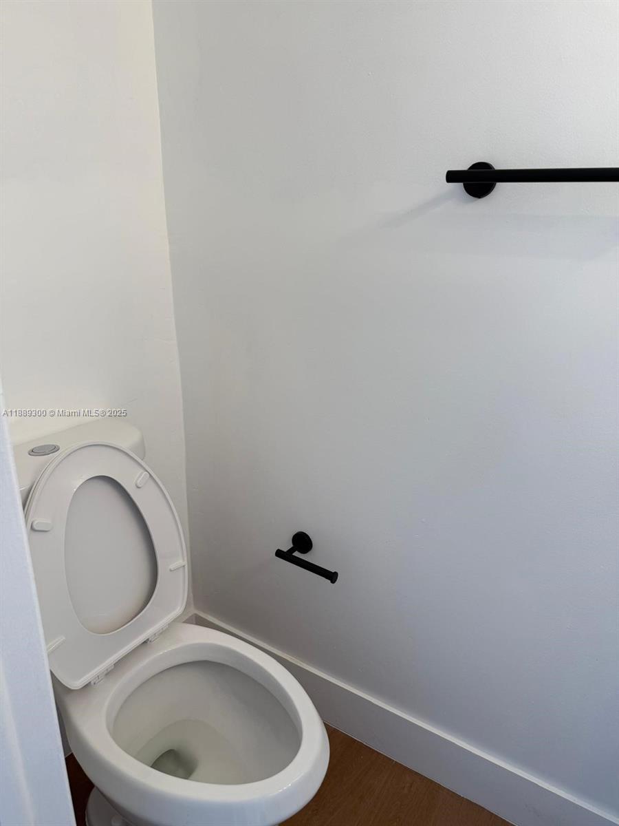 4163 Southwest 66th Terrace, Unit 108 Davie, FL 33314 - Photo 9 of 15 a bathroom with a toilet and a sink