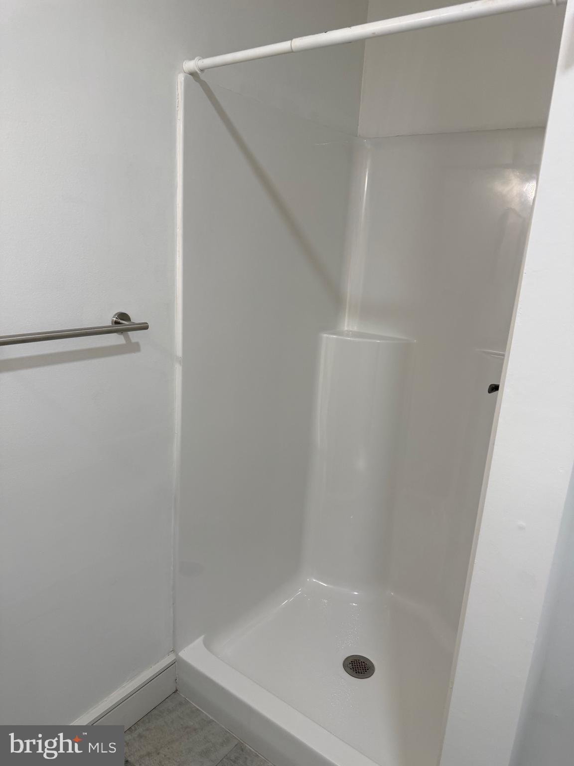 1087 Mt Tom Road, Unit 204 East Stroudsburg, PA 18301 - Photo 15 of 17 a bathroom with a glass shower door