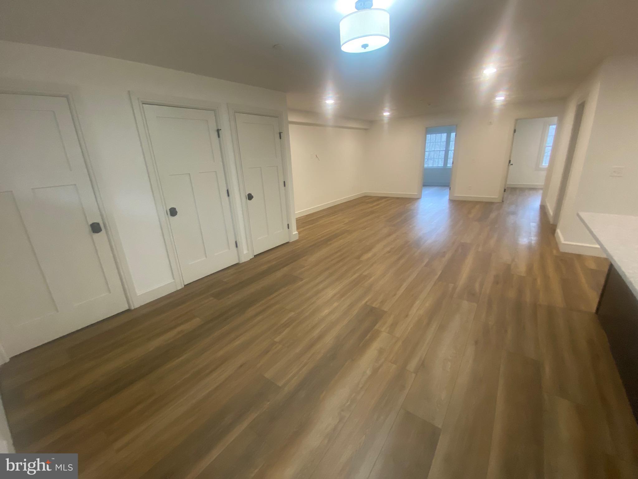 1087 Mt Tom Road, Unit 204 East Stroudsburg, PA 18301 - Photo 4 of 17 a view of a hallway with wooden floor