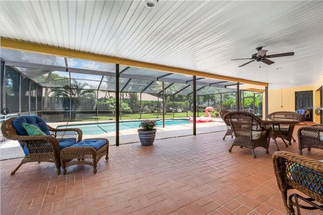 a building outdoor space with patio furniture and potted plants