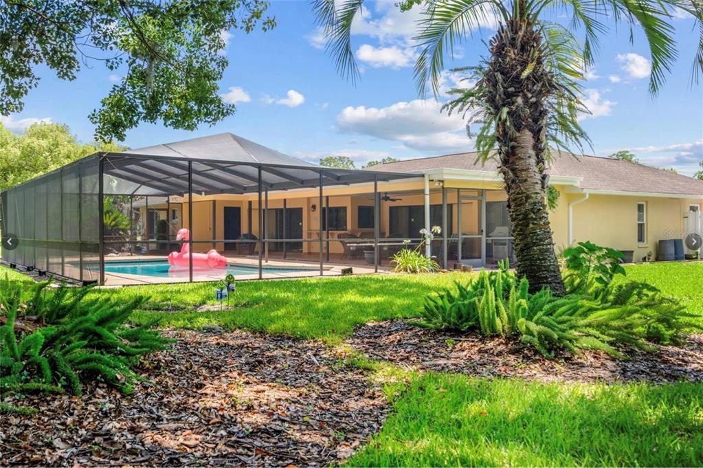 1255 Wisper Run Court Lutz, FL 33558 - Photo 22 of 25 a front view of a house with garden