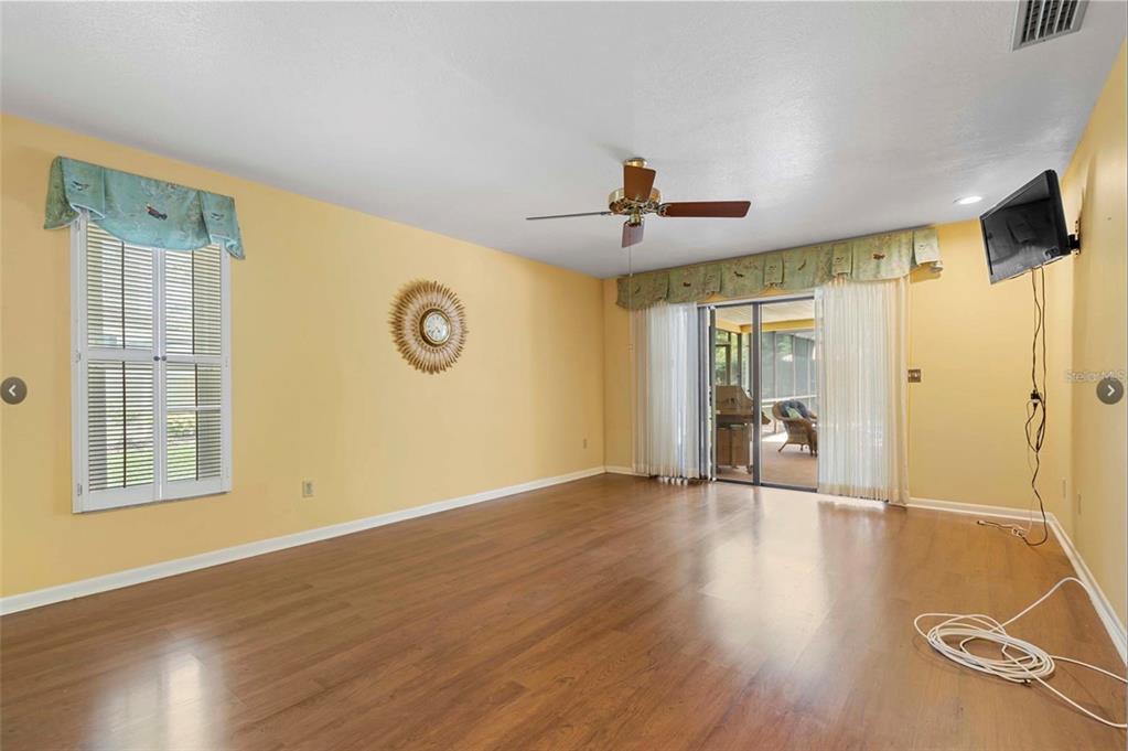 1255 Wisper Run Court Lutz, FL 33558 - Photo 10 of 25 a view of an empty room with glass door