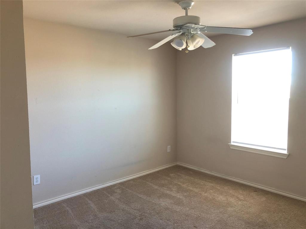 921 Parkplace Ridge Princeton, TX 75407 - Photo 12 of 12 an empty room with a window and a fan
