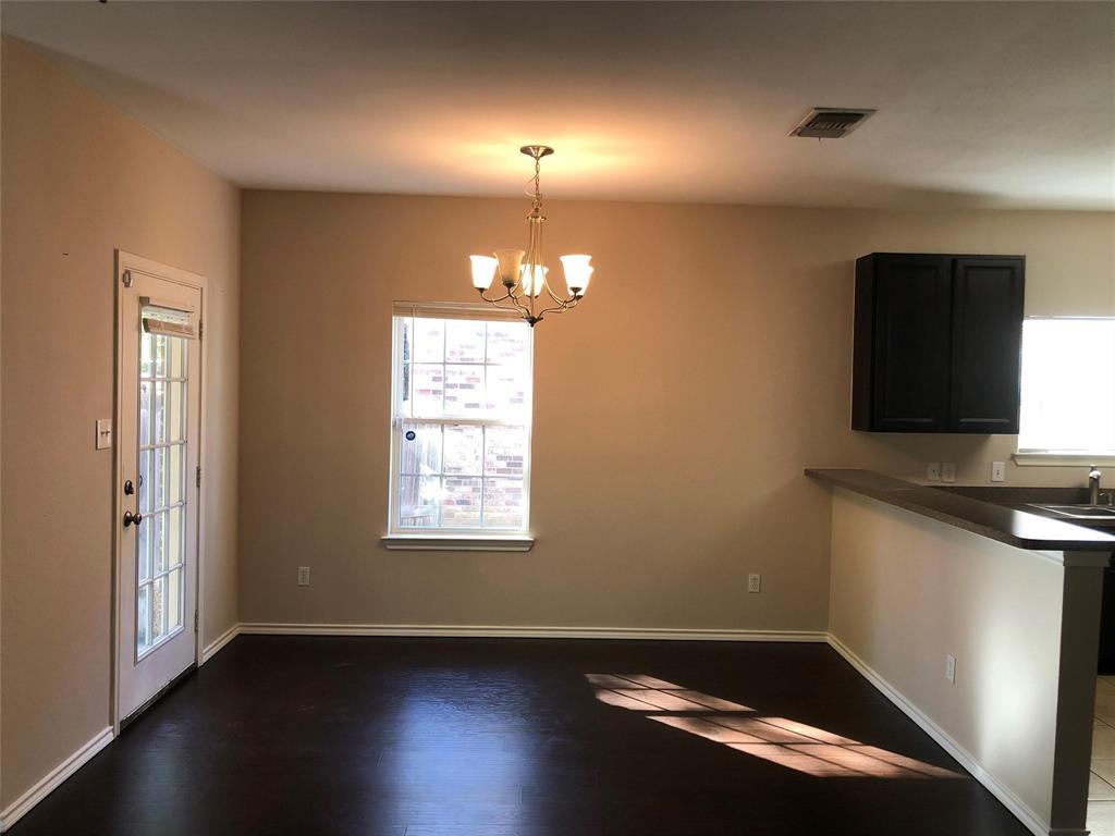 921 Parkplace Ridge Princeton, TX 75407 - Photo 4 of 12 a view of room with window and wooden floor