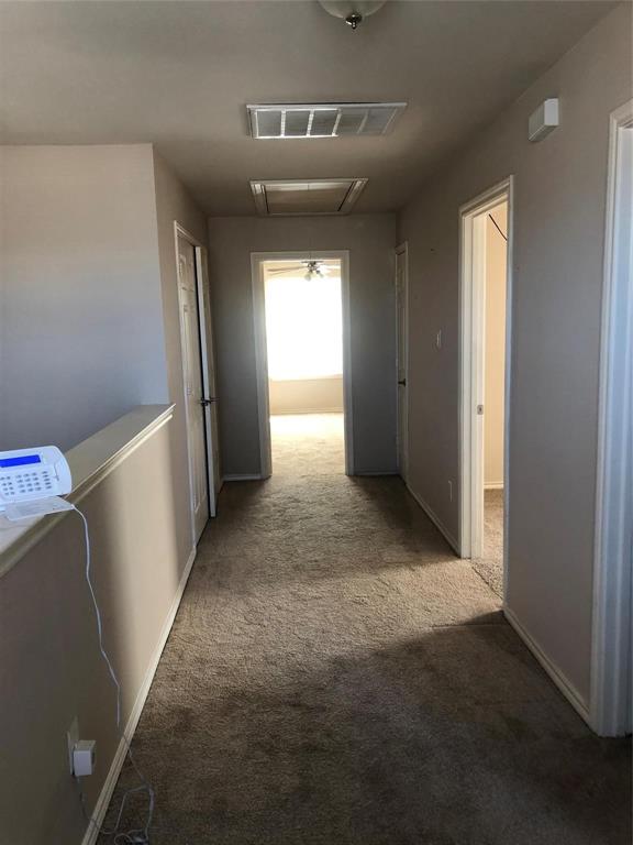 921 Parkplace Ridge Princeton, TX 75407 - Photo 5 of 12 a view of hallway with stairs and wooden floor