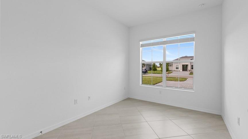 5406 Ternberry Road Ave Maria, FL 34142 - Photo 6 of 45 a view of an empty room and a window