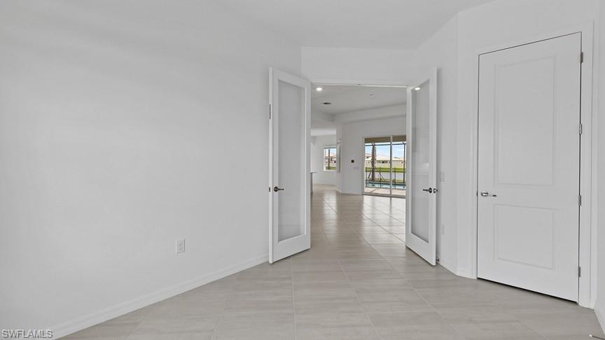 5406 Ternberry Road Ave Maria, FL 34142 - Photo 7 of 45 a view of a room with a hallway and wooden floor