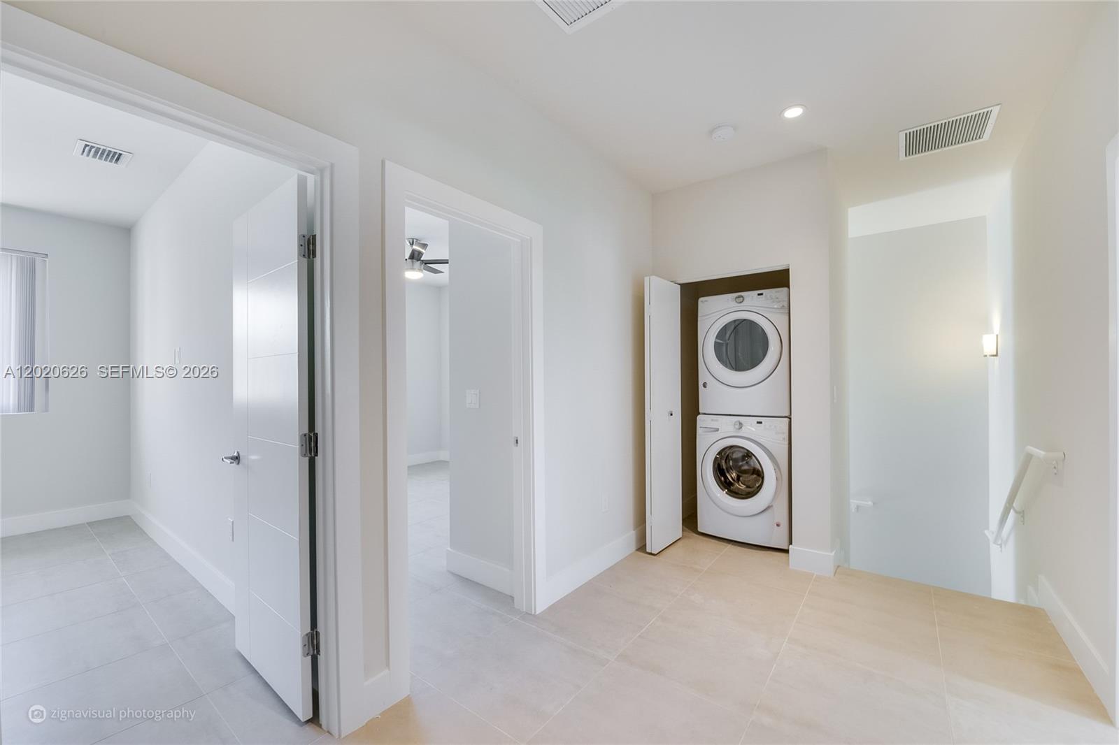 7701 Southwest 95th Terrace, Unit 1 Miami, FL 33156 - Photo 12 of 18 a view of a storage & utility room with washer and dryer