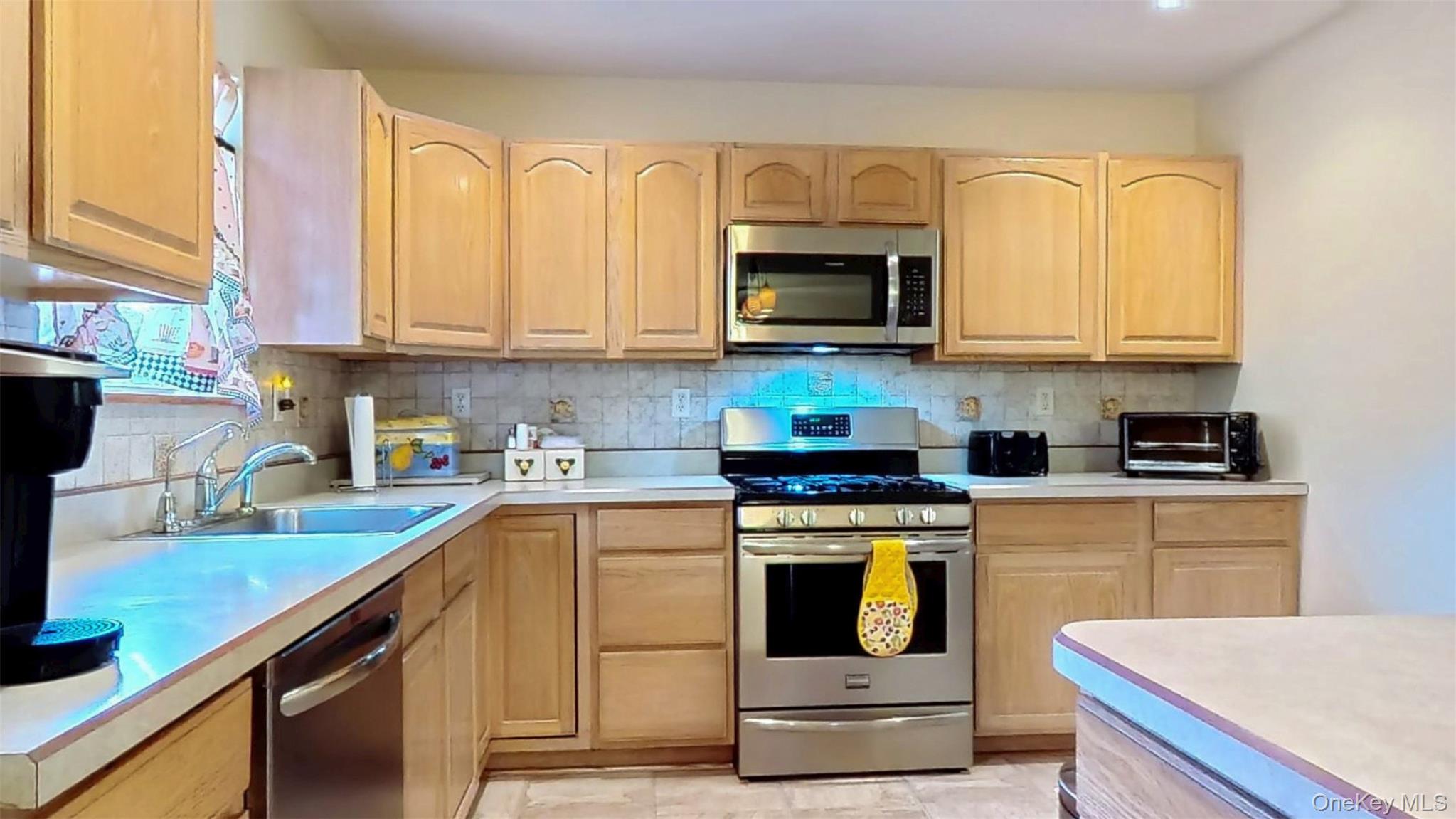 125 White Bridge Road Middletown, NY 10940 - Photo 14 of 43 Kitchen with light brown cabinets, appliances with stainless steel finishes, and light countertops