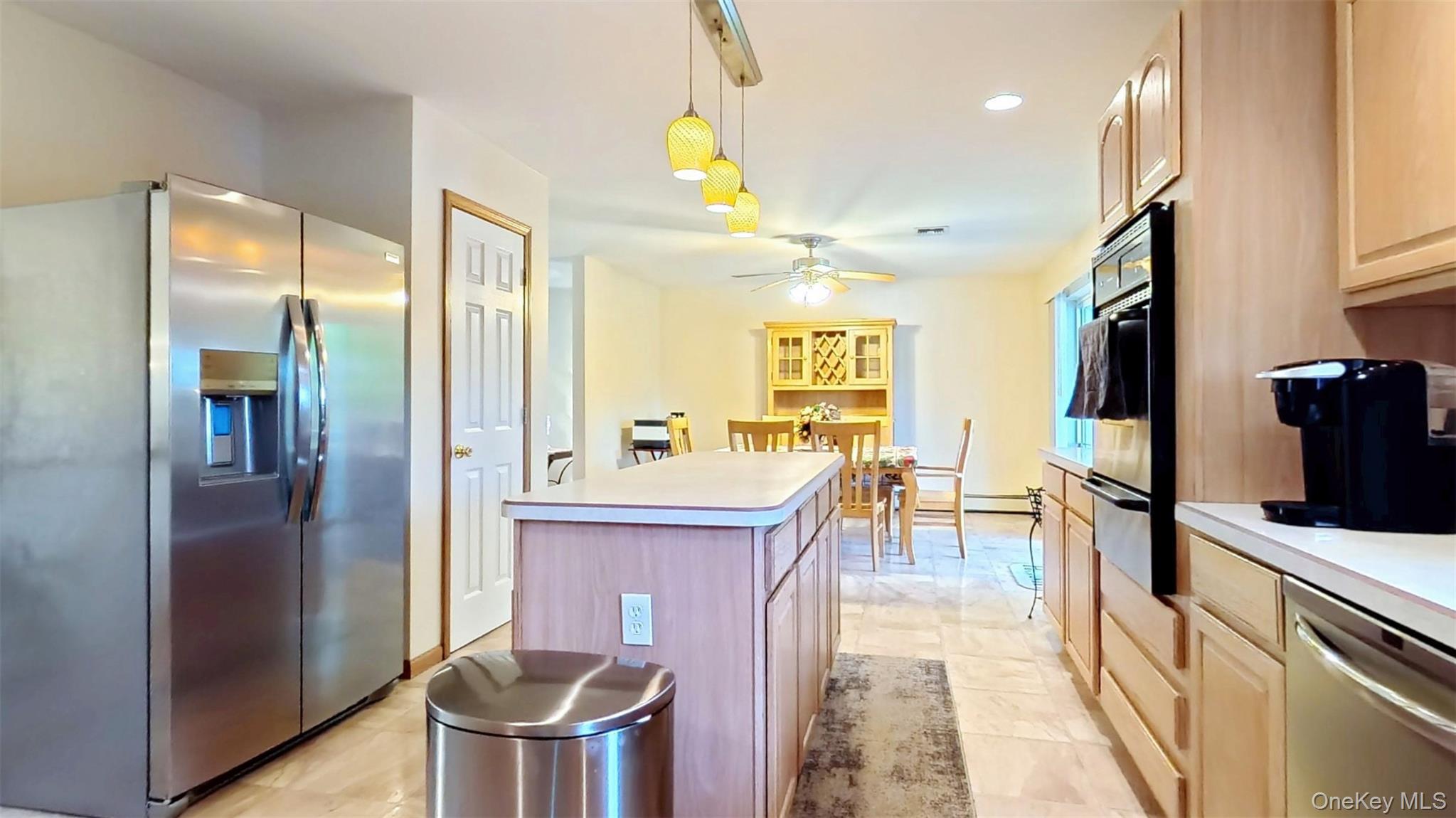 125 White Bridge Road Middletown, NY 10940 - Photo 18 of 43 Kitchen featuring stainless steel appliances, light brown cabinets, decorative light fixtures, light countertops, and recessed lighting