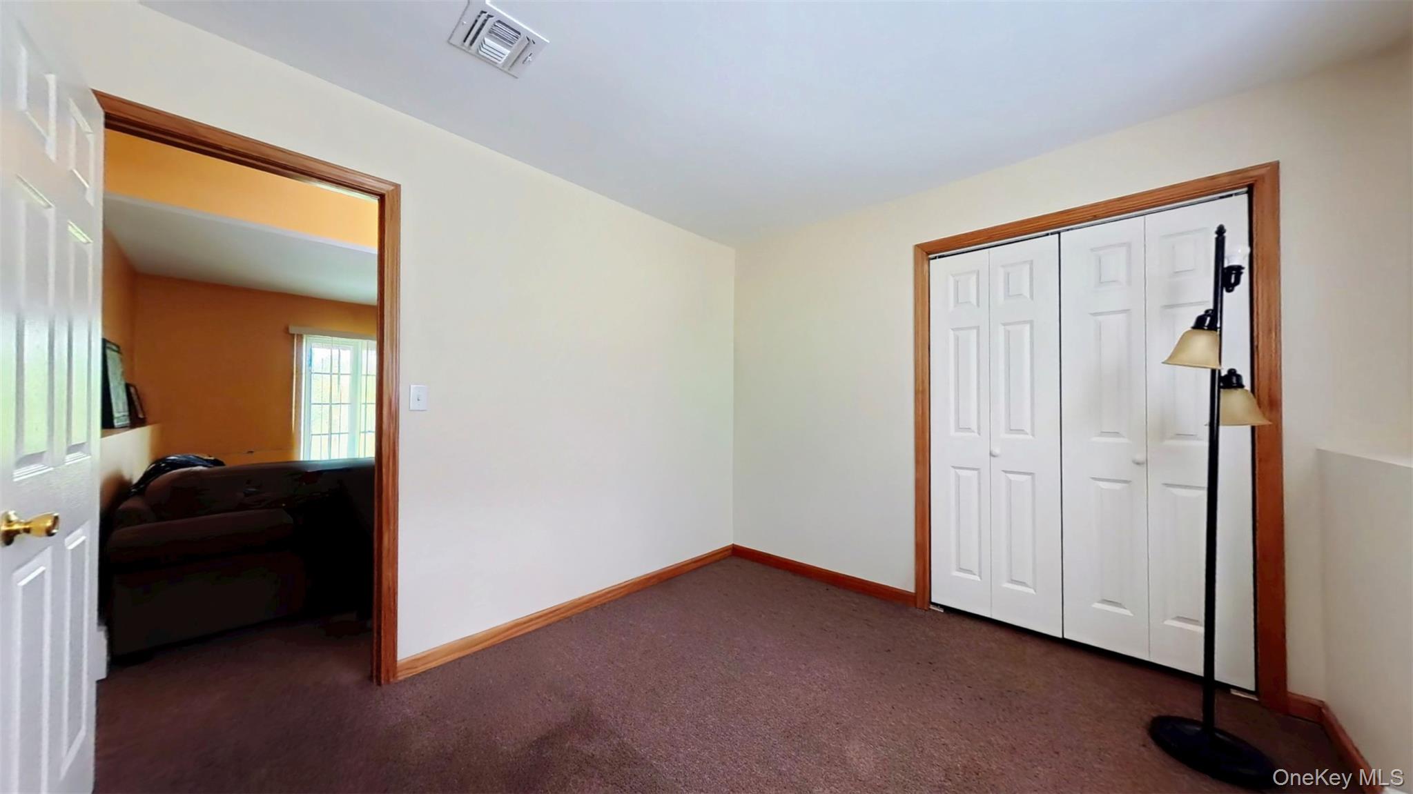 125 White Bridge Road Middletown, NY 10940 - Photo 22 of 43 Unfurnished bedroom with dark carpet and a closet