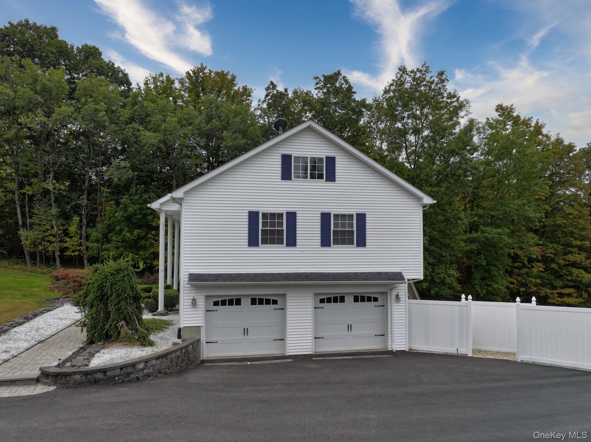 125 White Bridge Road Middletown, NY 10940 - Photo 30 of 43 View of home's exterior featuring asphalt driveway and an attached garage