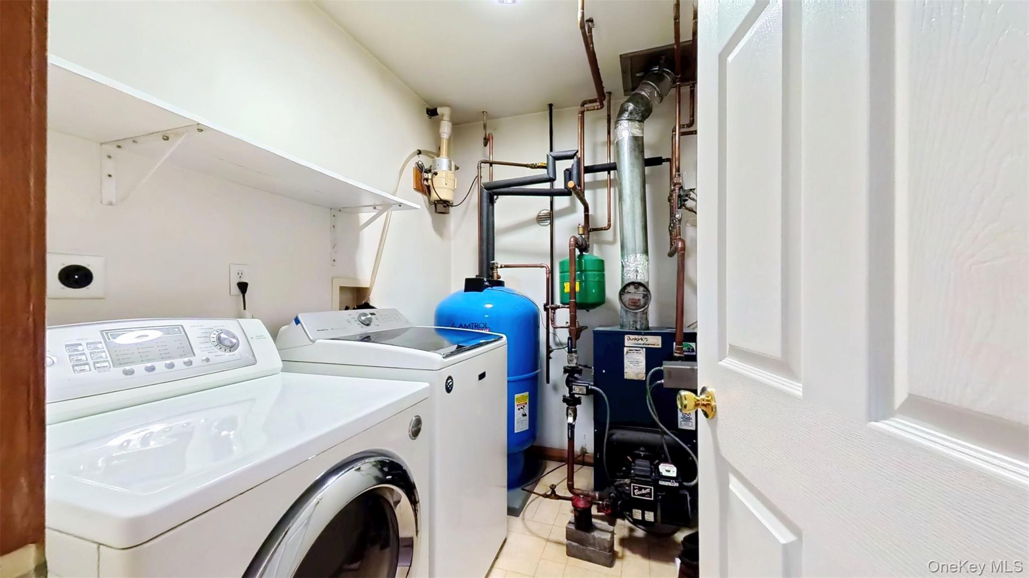 125 White Bridge Road Middletown, NY 10940 - Photo 37 of 43 Laundry room featuring a heating unit, independent washer and dryer, and light tile patterned flooring