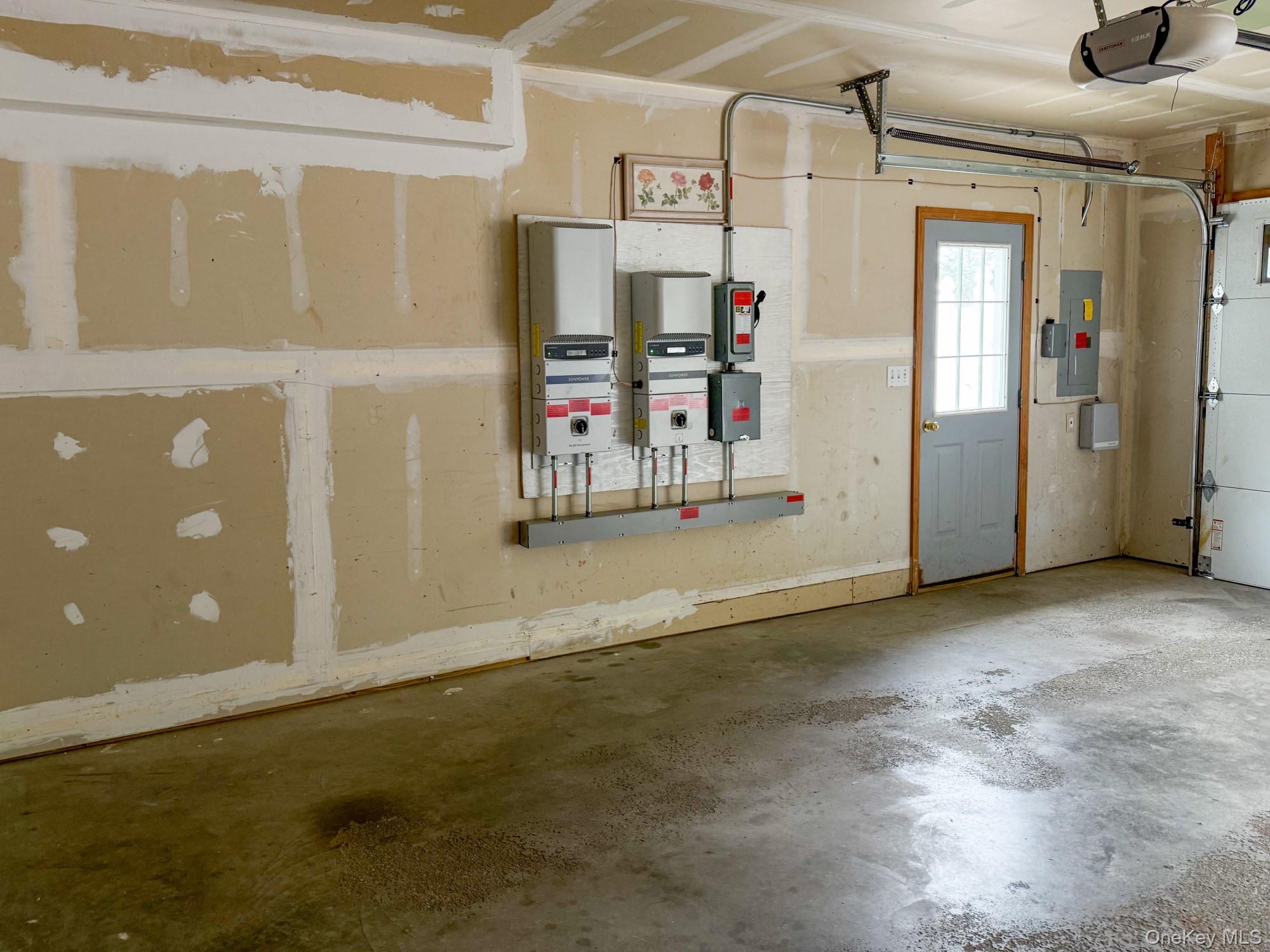 125 White Bridge Road Middletown, NY 10940 - Photo 39 of 43 Garage with a garage door opener and electric panel