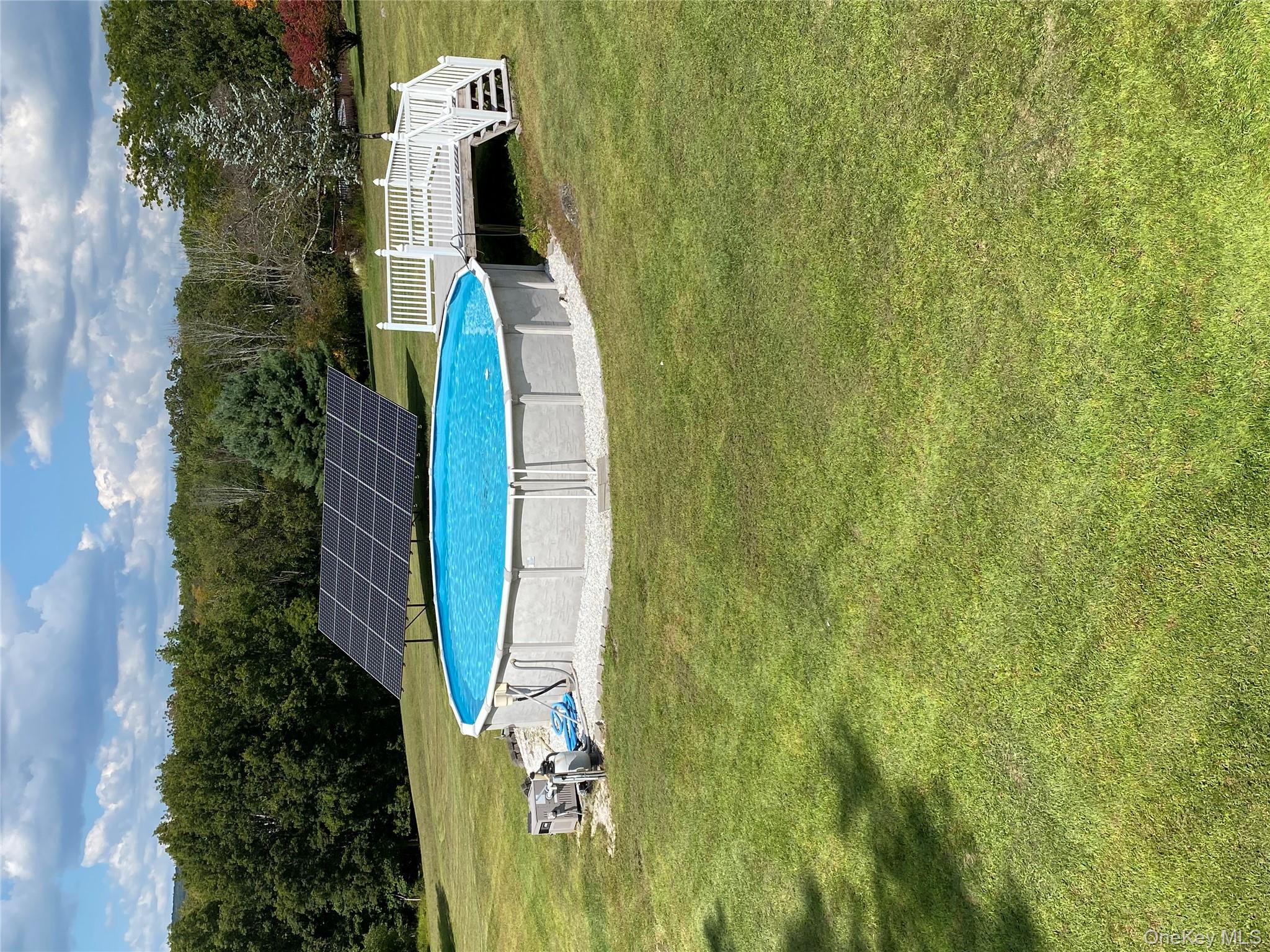 125 White Bridge Road Middletown, NY 10940 - Photo 42 of 43 Outdoor pool featuring solar array