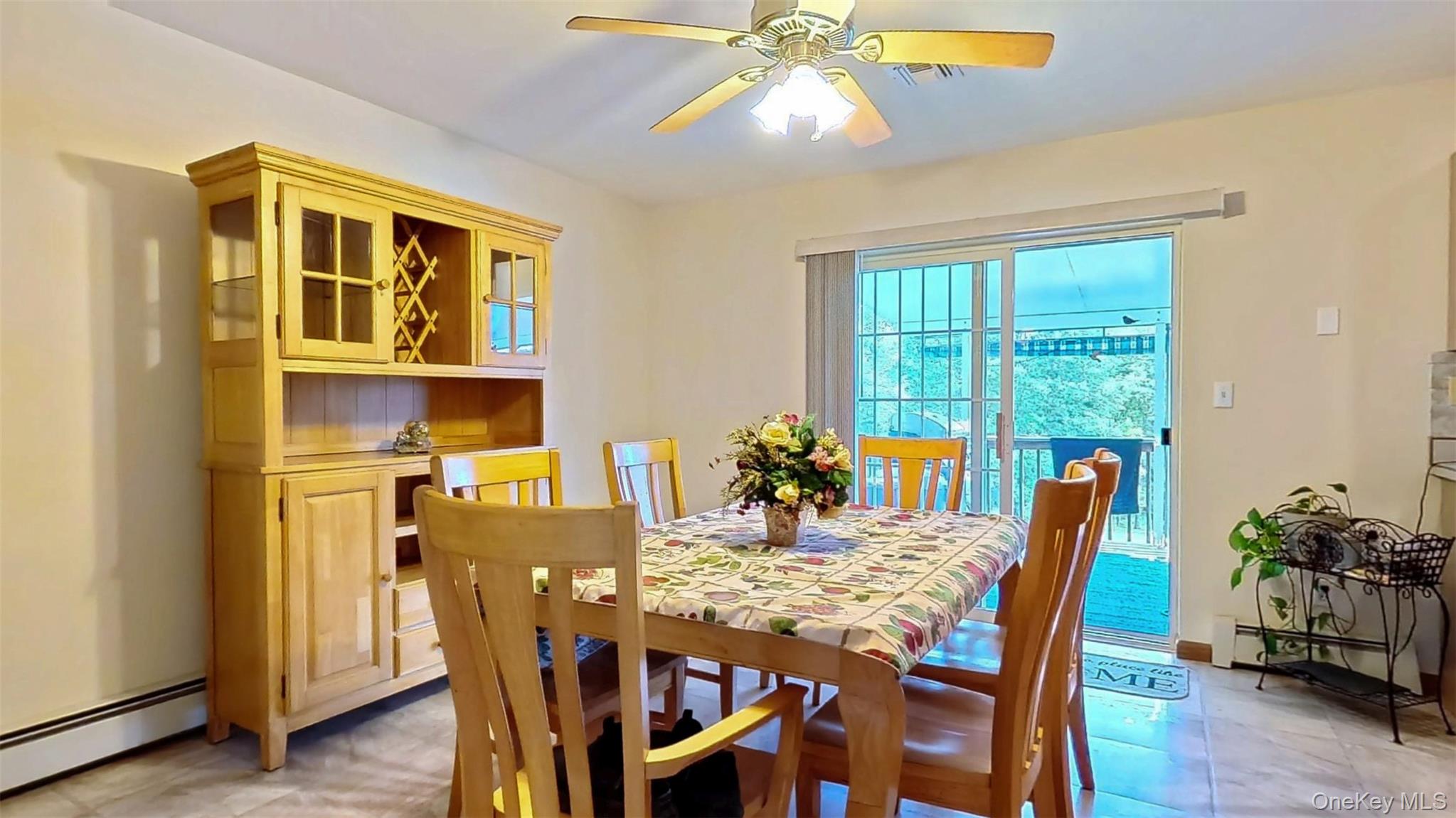 125 White Bridge Road Middletown, NY 10940 - Photo 10 of 43 Dining area with a baseboard radiator, baseboard heating, and ceiling fan