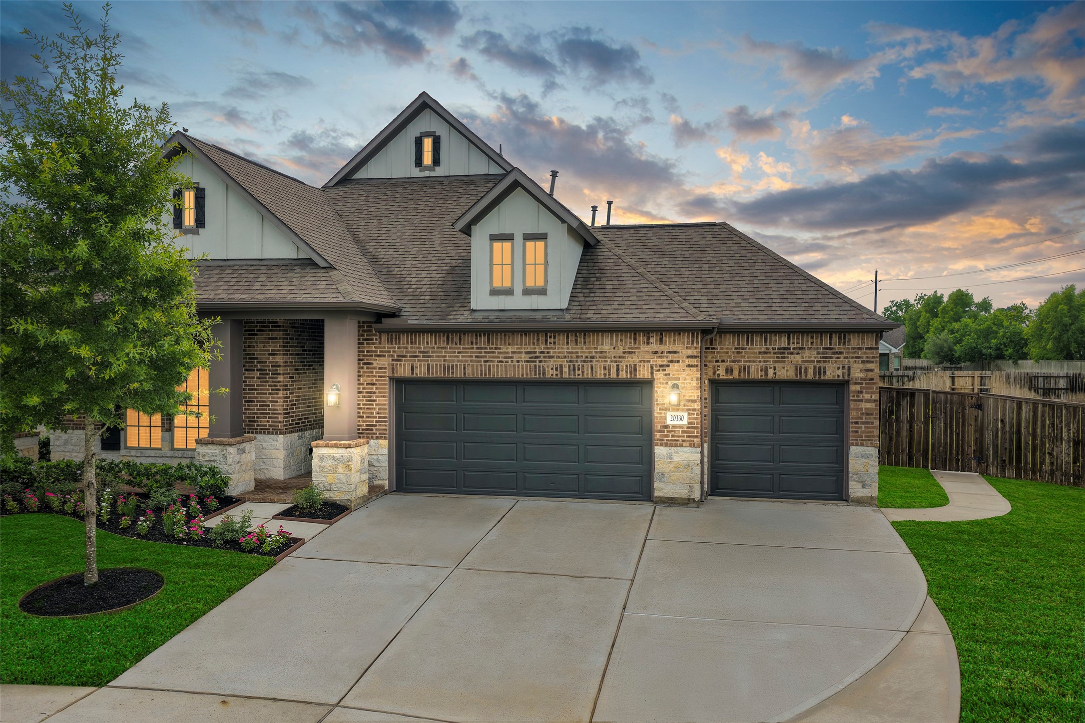 20330 Rosegold Way Spring, TX 77379 - Photo 1 of 48 Beautiful brick and stone elevation with a spacious 3-car garage and impressive curb appeal.