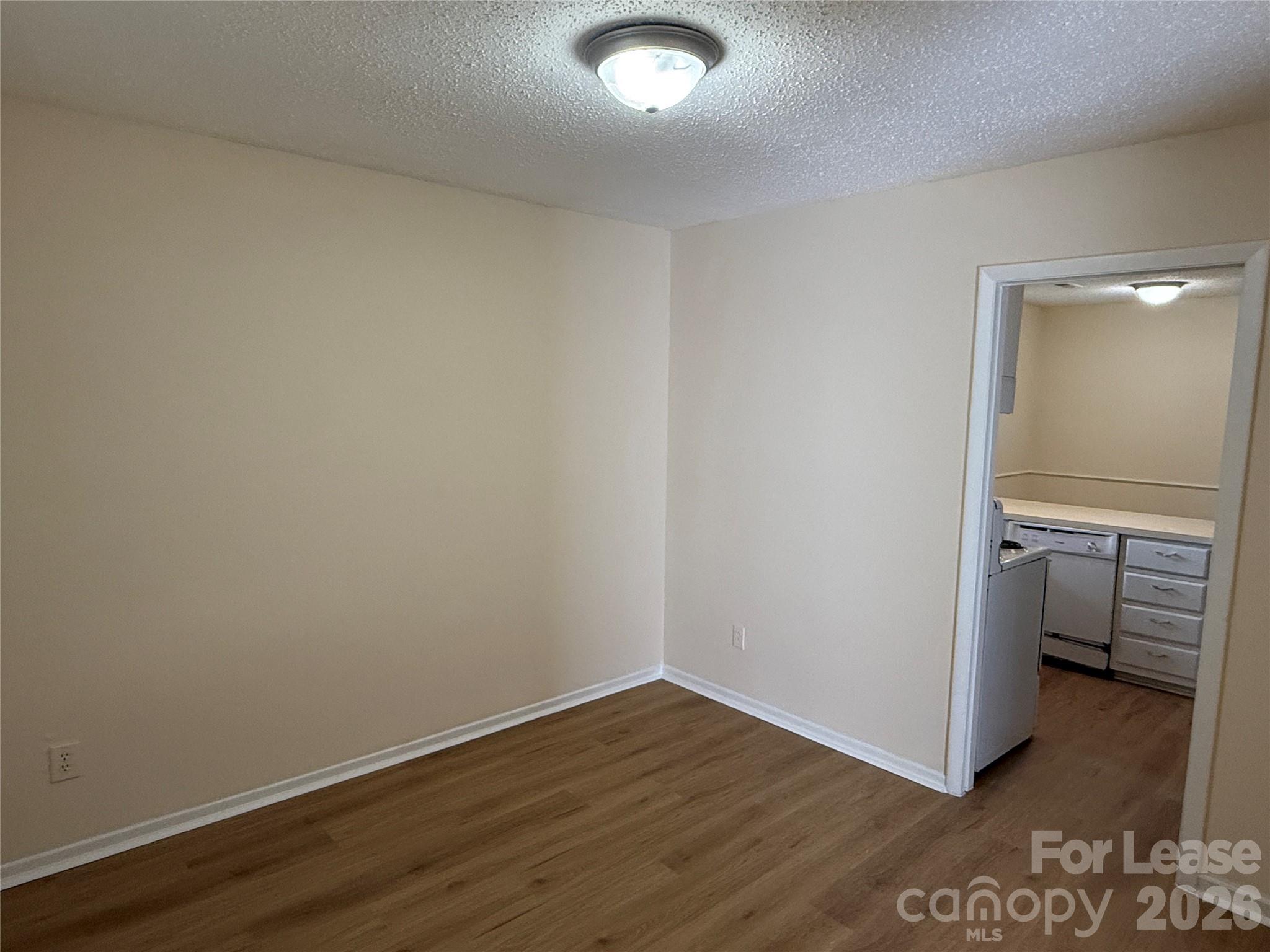 6341 Round Hill Road Charlotte, NC 28211 - Photo 6 of 16 a view of a room with wooden floor and closet