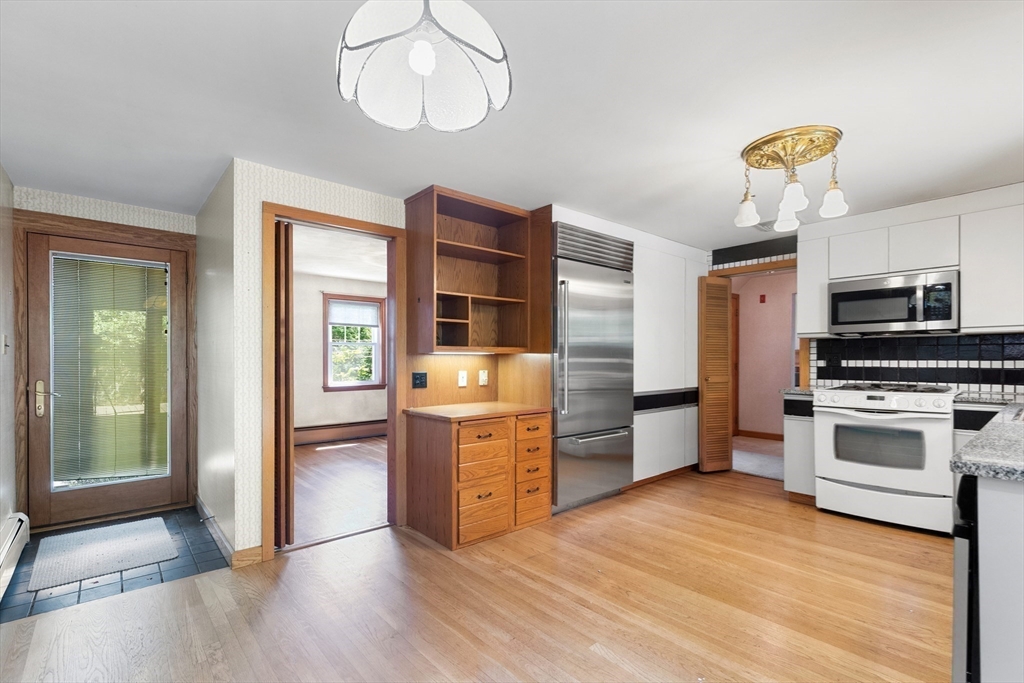 11 Tower Road Lexington, MA 02421 - Photo 11 of 33 a kitchen with stainless steel appliances a stove oven and a refrigerator