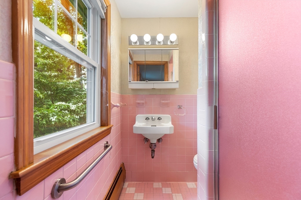 11 Tower Road Lexington, MA 02421 - Photo 15 of 33 a bathroom with a sink and a mirror