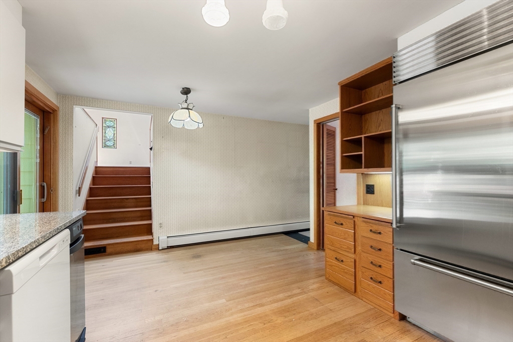 11 Tower Road Lexington, MA 02421 - Photo 21 of 33 a view of a livingroom with wooden floor and stairs