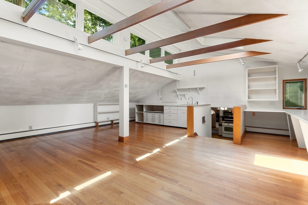11 Tower Road Lexington, MA 02421 - Photo 23 of 33 a view of a livingroom with wooden floor and staircase