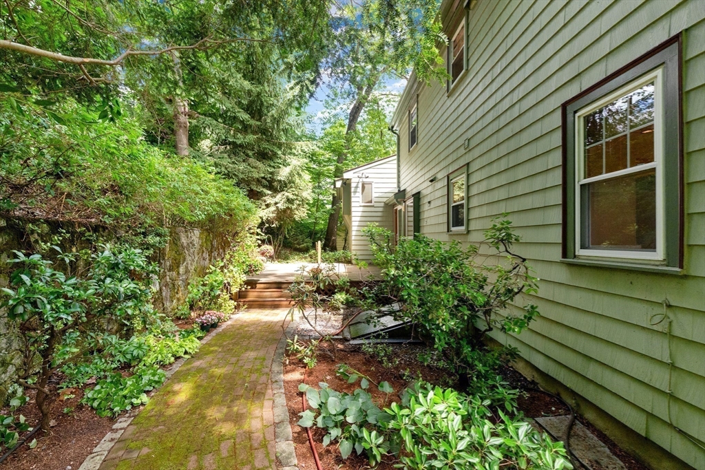 11 Tower Road Lexington, MA 02421 - Photo 28 of 33 a backyard of a house with lots of green space
