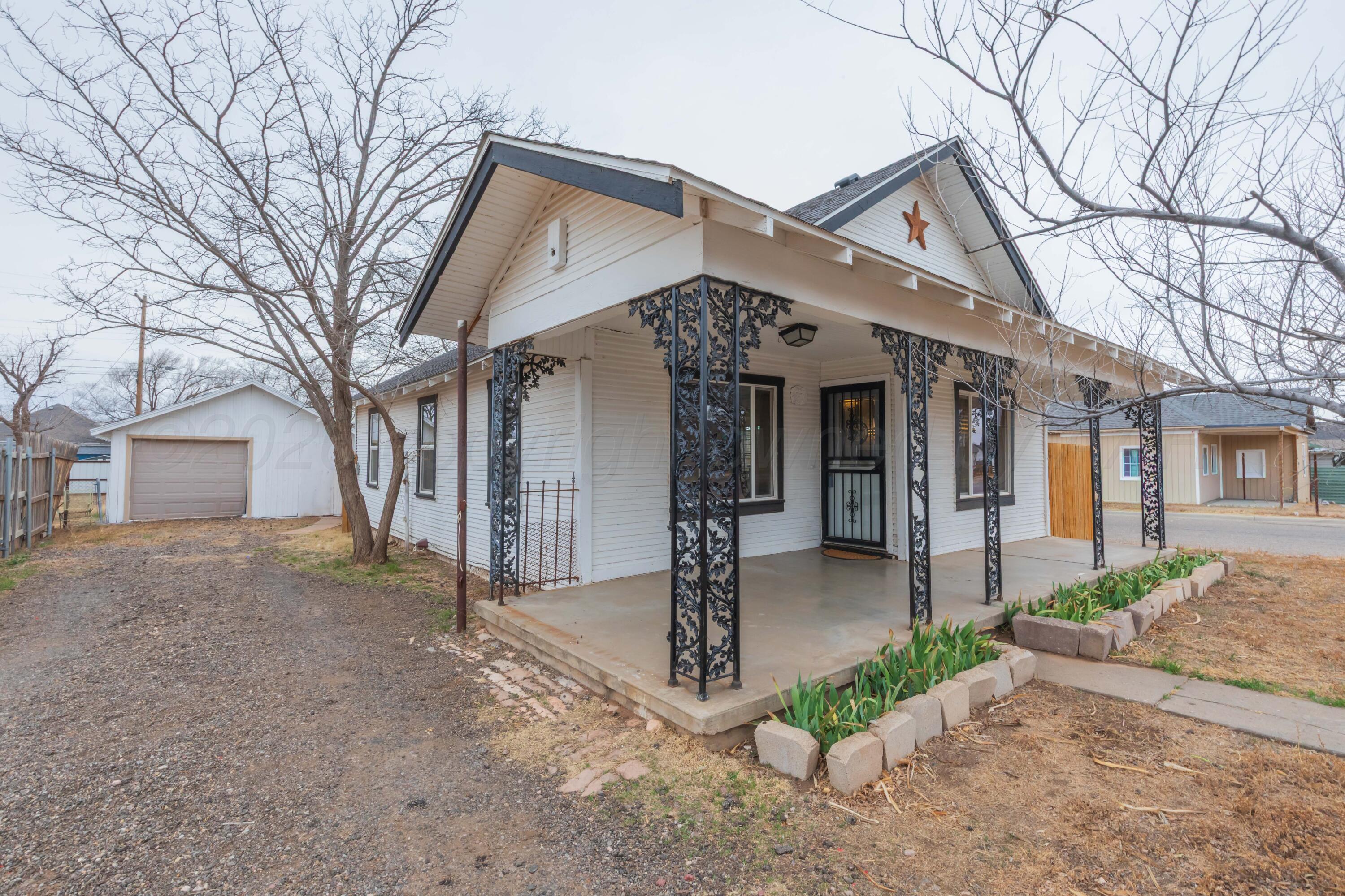 91 North Alabama Street Amarillo, TX 79106 - Photo 1 of 28 a front view of a house with garden and plants