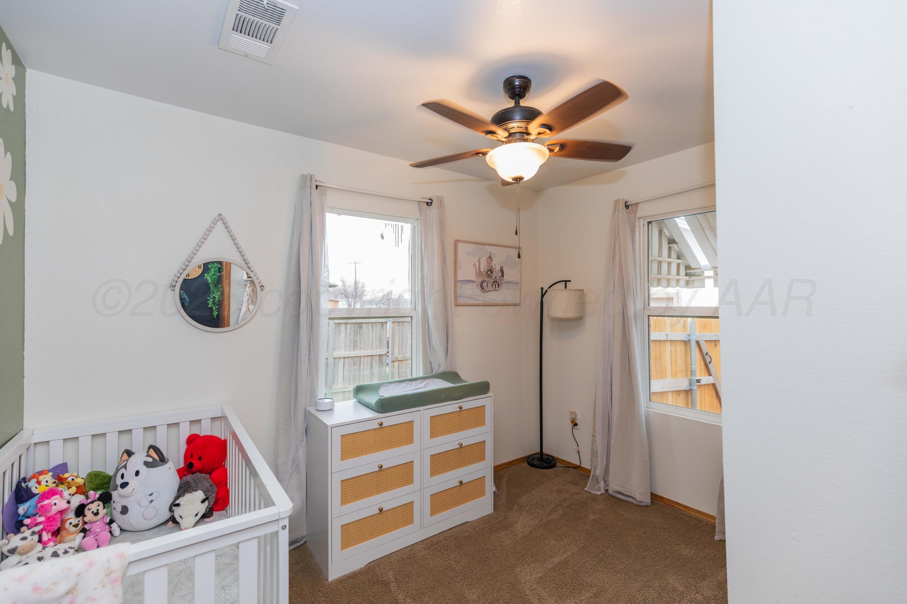 91 North Alabama Street Amarillo, TX 79106 - Photo 19 of 28 a bedroom with furniture and a window