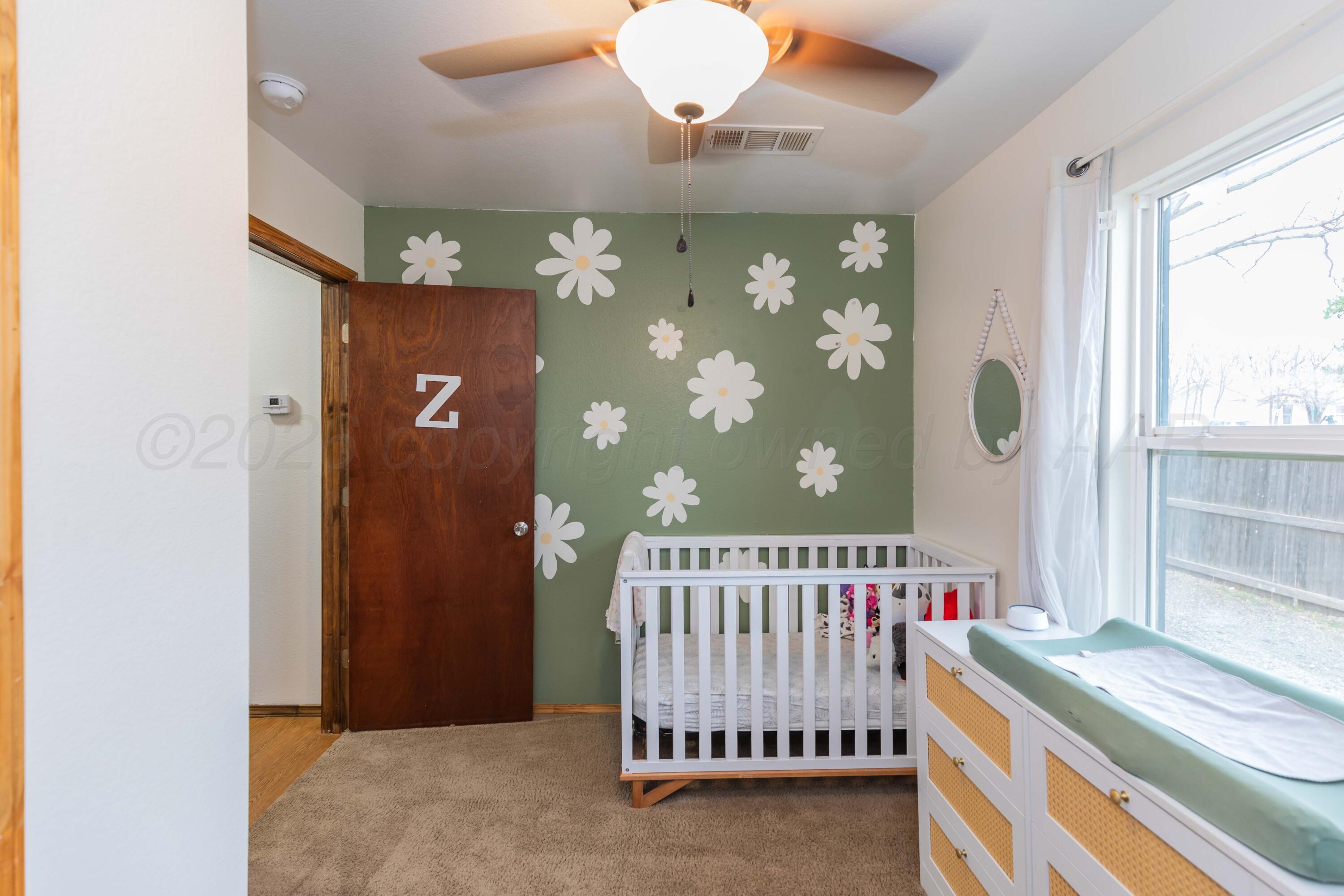 91 North Alabama Street Amarillo, TX 79106 - Photo 20 of 28 a bedroom with a bed and a window