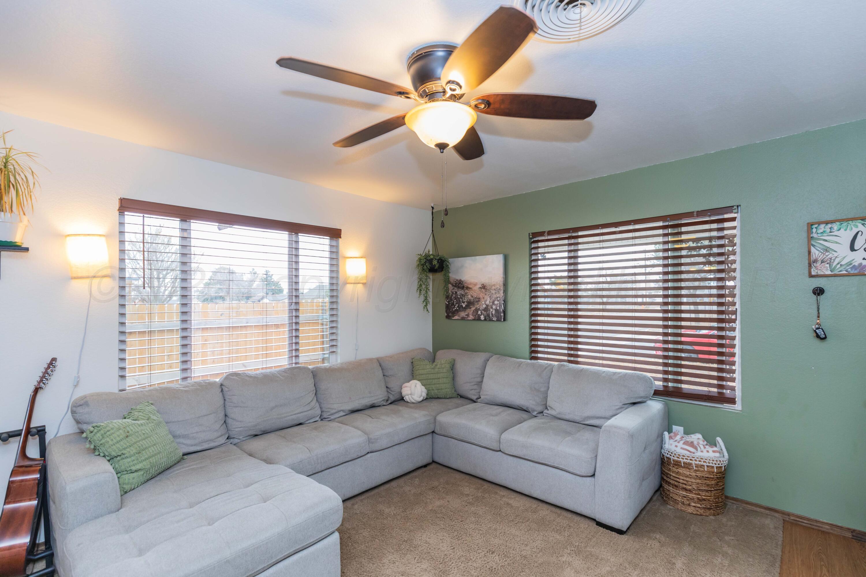 91 North Alabama Street Amarillo, TX 79106 - Photo 4 of 28 a living room with furniture and a large window