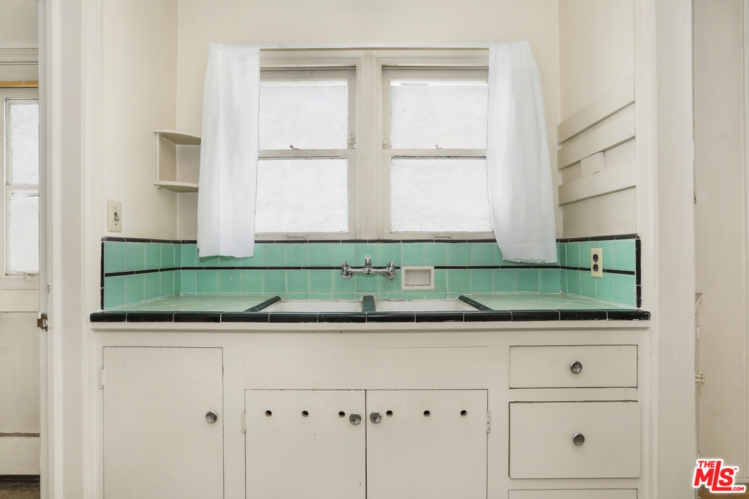 4053 Verdugo Road Los Angeles, CA 90065 - Photo 1 of 45 a bathroom with a sink and a mirror