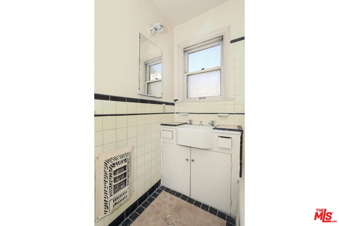 4053 Verdugo Road Los Angeles, CA 90065 - Photo 14 of 45 a bathroom with a sink and a mirror